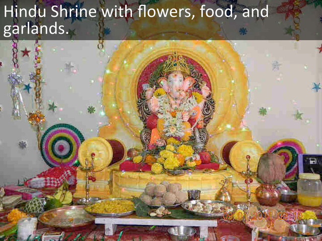 Hindu	  Shrine	  with	  ﬂowers,	  food,	  and	  
garlands.	  
