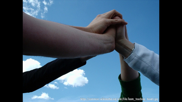 https://commons.wikimedia.org/wiki/File:Team_touching_hands.jpg

